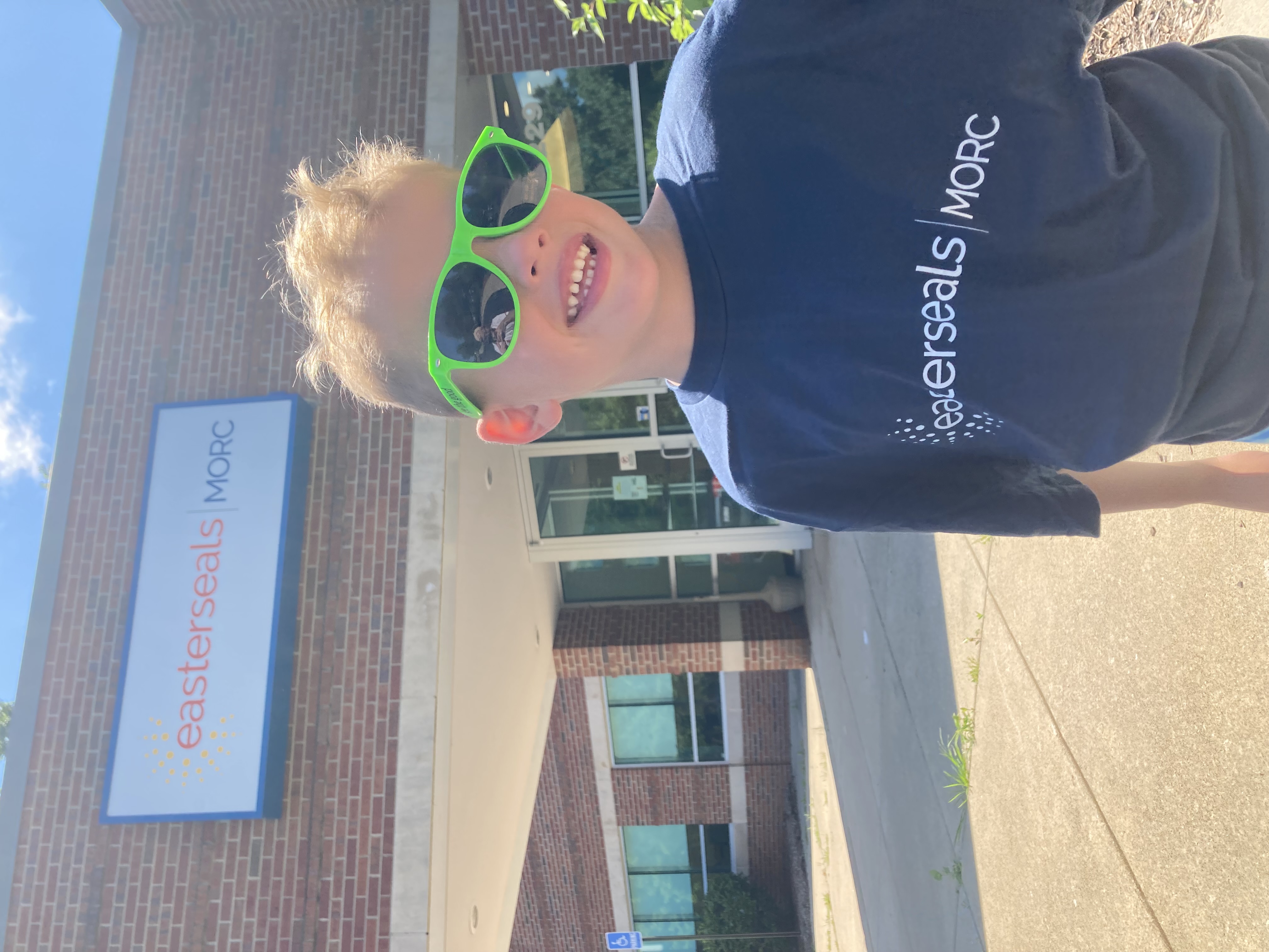 Image of young boy, Liam, with sunglasses on