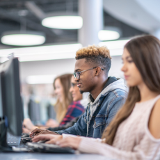 high school students workin in a computer lab