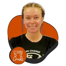 Smiling woman in front of funky orange background