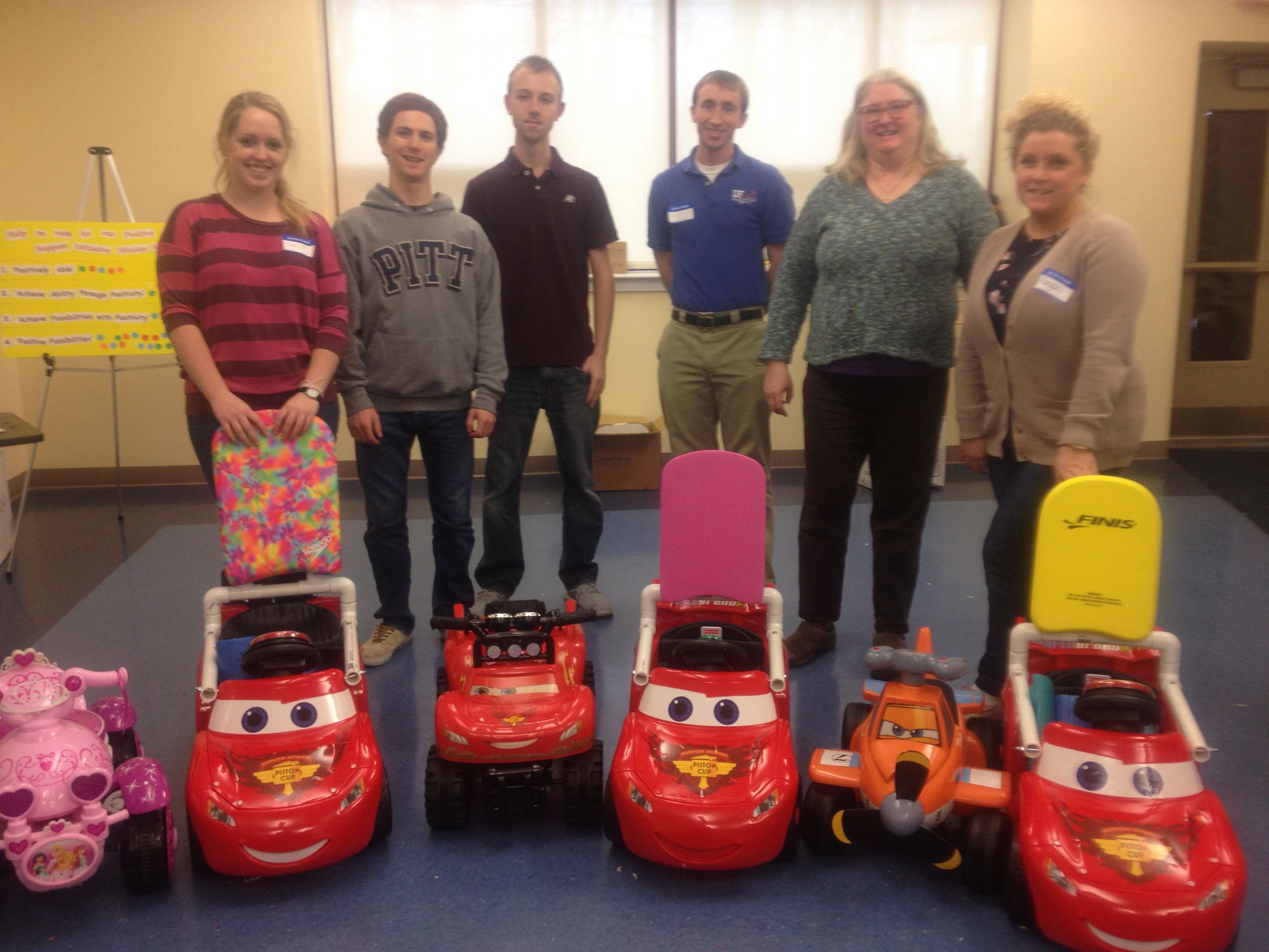 Volunteers with adapted cars