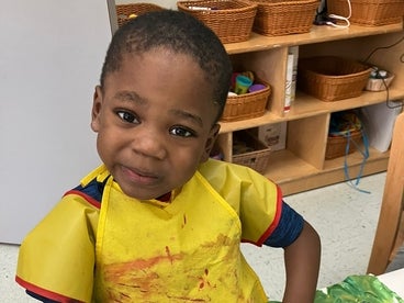 young boy participating in an art program