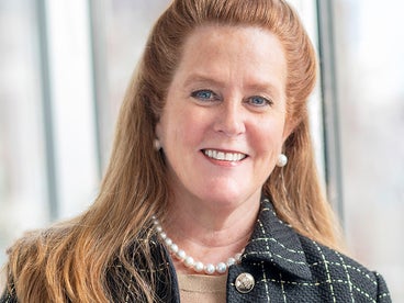 Portrait of Kendra Davenport wearing a suit jacket 