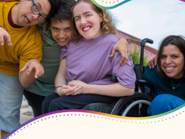 A group of teens and young adults with disabilities smiling playfully 
