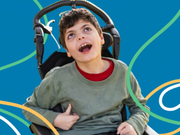 A young boy using a wheelchair