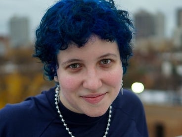 Liz with short blue hair, smiling