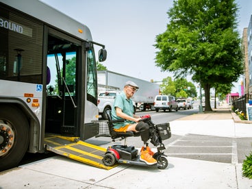 Man uses ramp on a public bus