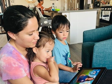 Mother with son and daughter on ipad