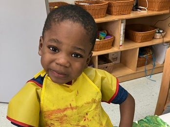 young boy participating in an art program
