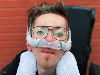 Steve Way sitting in his wheelchair, wearing glasses 