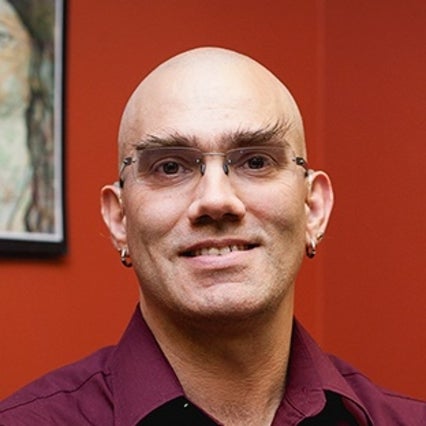 Headshot of Crom Saunders