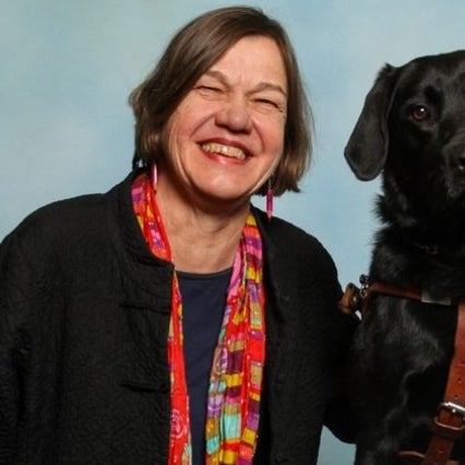 Headshot of Beth Finke with her seeing eye dog 