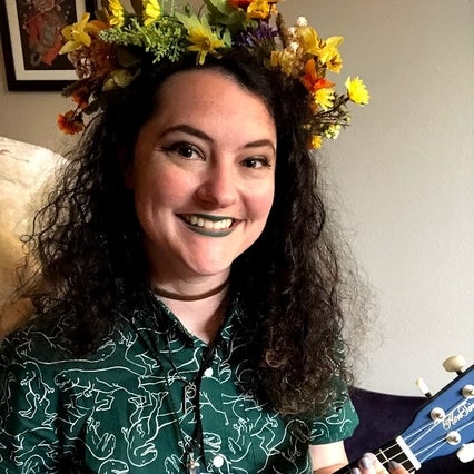 Anna Goldberg holding a colorful ukulele