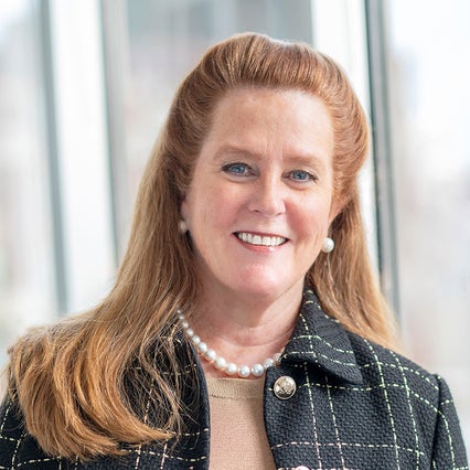 Portrait of Kendra Davenport wearing a suit jacket 