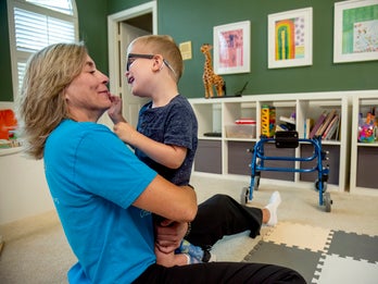 Luke gets supportive play time in his home