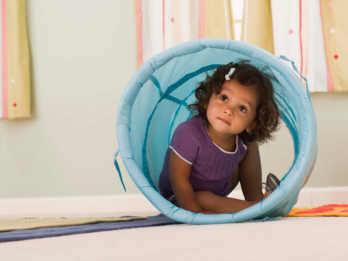 Little girl inside tunnel