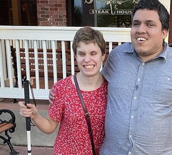 Alicia and friend outside restaurant 