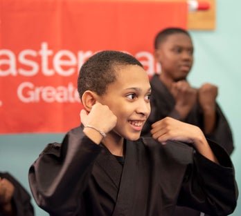 young boy in a martial arts class in easterseals greater houston