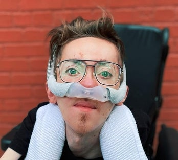 Steve Way sitting in his wheelchair, wearing glasses 