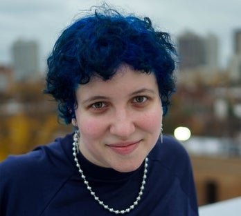 Liz with short blue hair, smiling