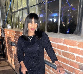 Andrea wearing a black dress
