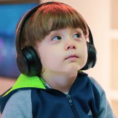 Boy with autism wearing headphones