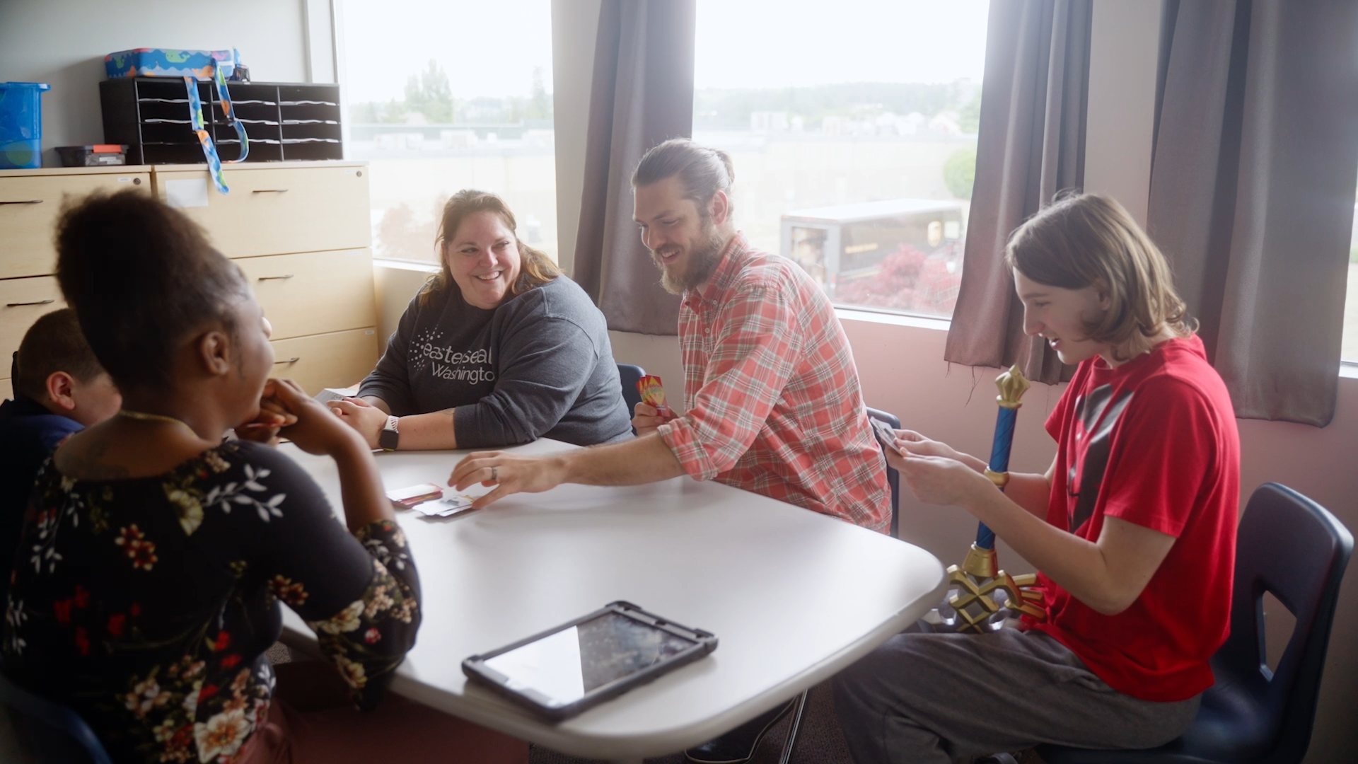Playing a card game at OPAC